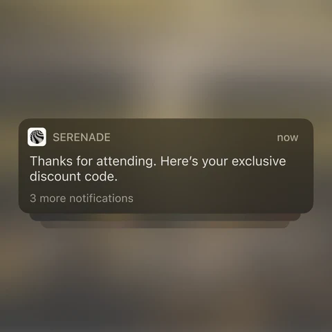 A phone showing a Serenade notification after an event: thanks for attending, here's your exclusive discount code
